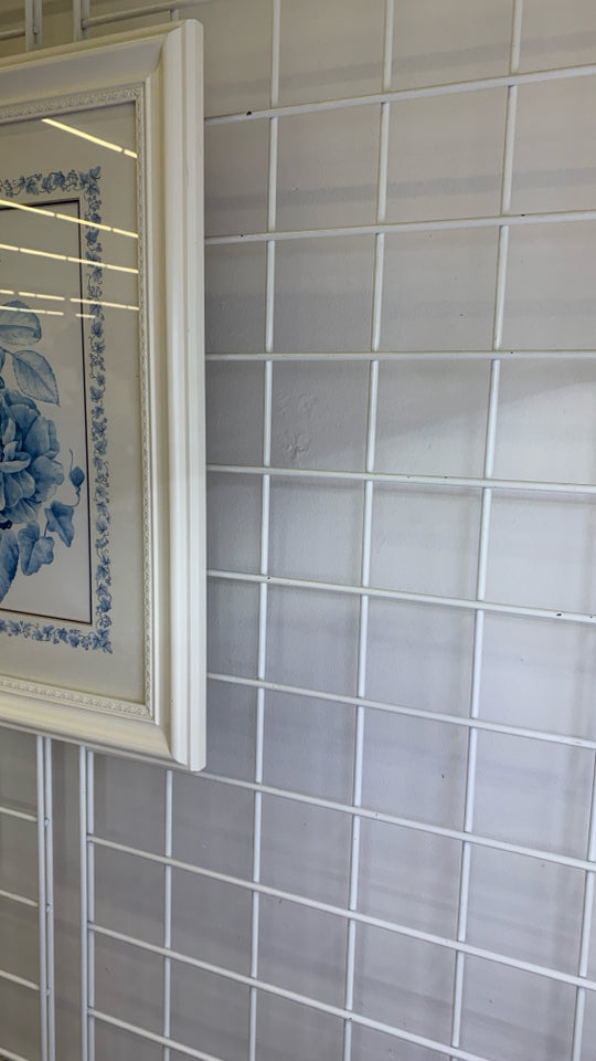 BLUE FLOWERS IN WHITE BACKGROUND IN WHITE FRAME WALL ART.