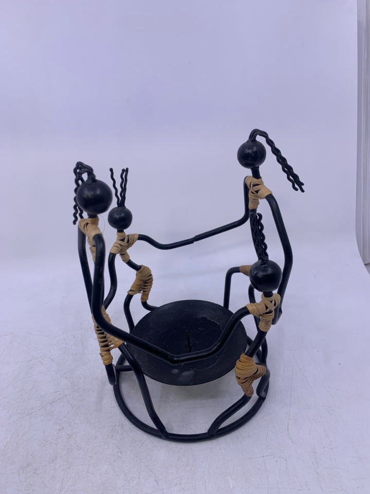 BLACK METAL 4 PEOPLE HOLDING HANDS PILLAR CANDLE HOLDER FOLK ART.