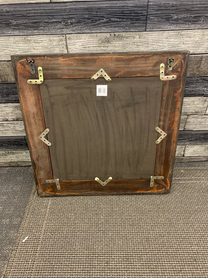 DARK BROWN CARVED WOOD SQUARE FRAMED MIRROR.