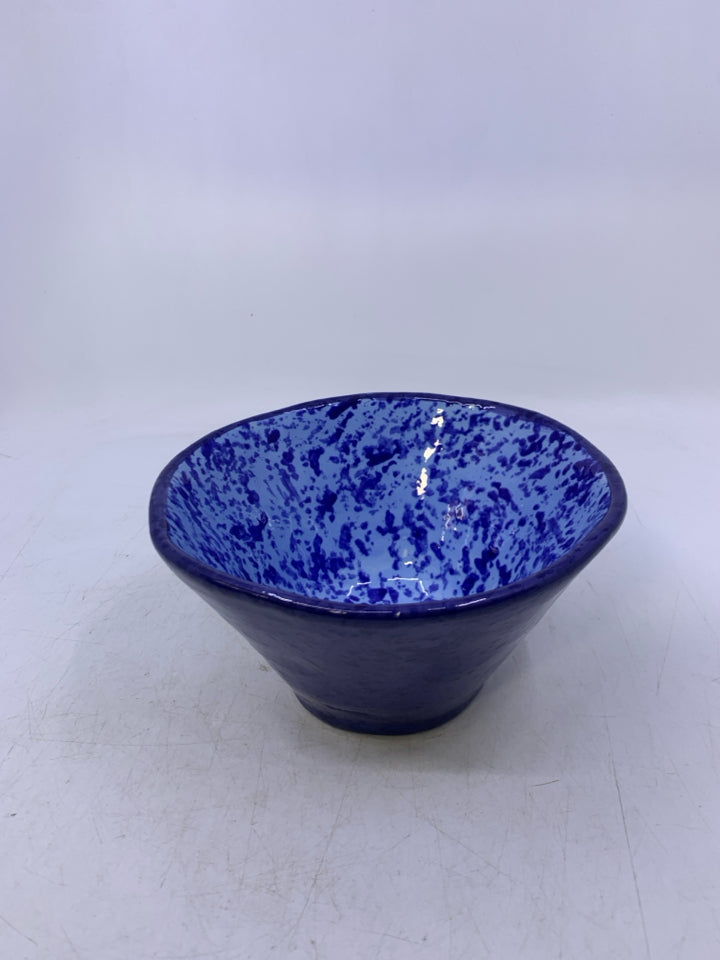 DARK BLUE CERAMIC BOWL W/ BLUE DOTS INSIDE.