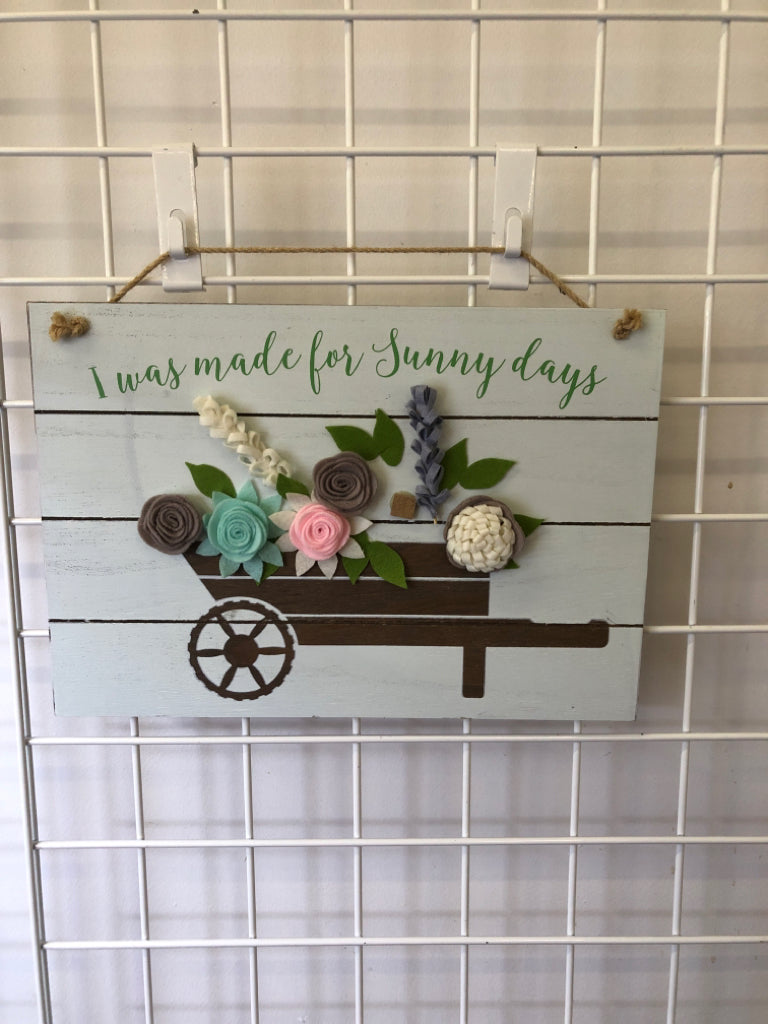 MADE FOR SUNNY DAYS-WHEELBARROW FULL OF FLOWERS.