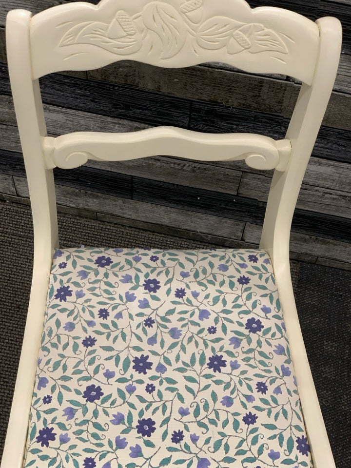 2 CREAM PAINTED SIDE CHAIRS W/BLUE FLORAL FABRIC SEAT.