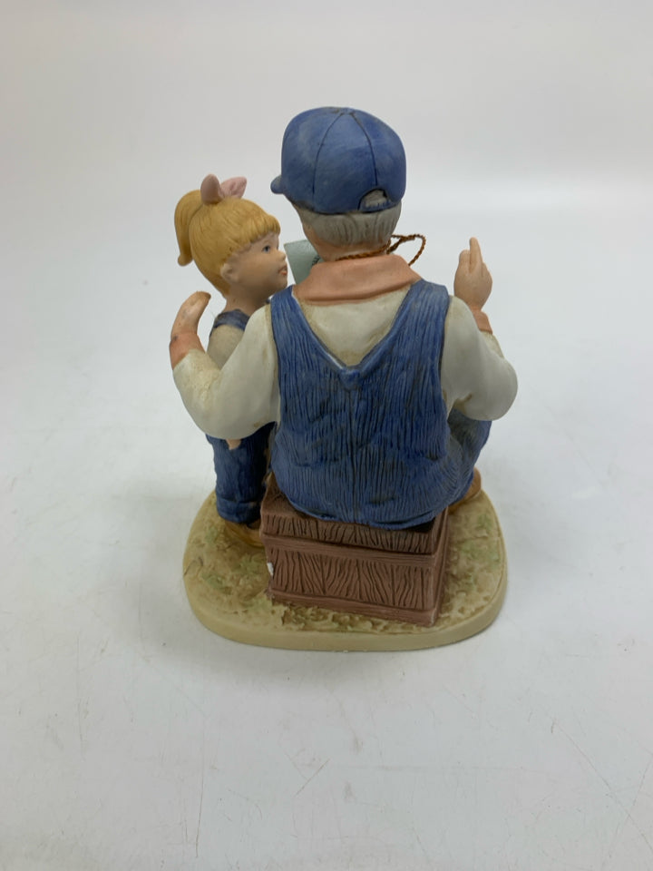 DENIM DAYS FATHER READING TO GIRL.