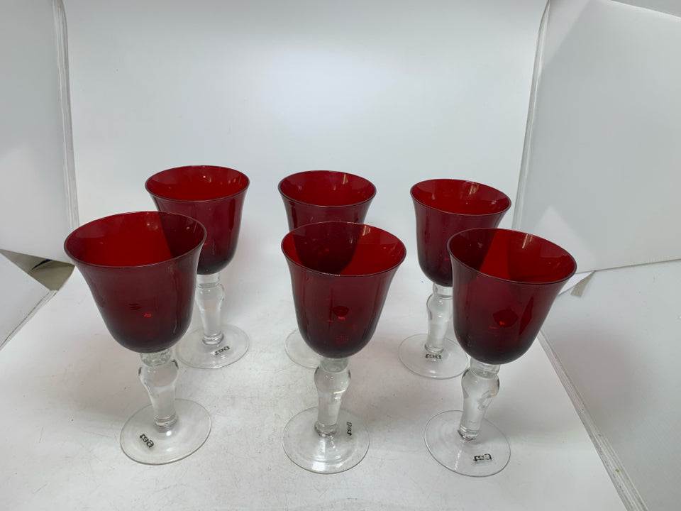 6 RED WINE GOBLETS W/ CLEAR STEMS.