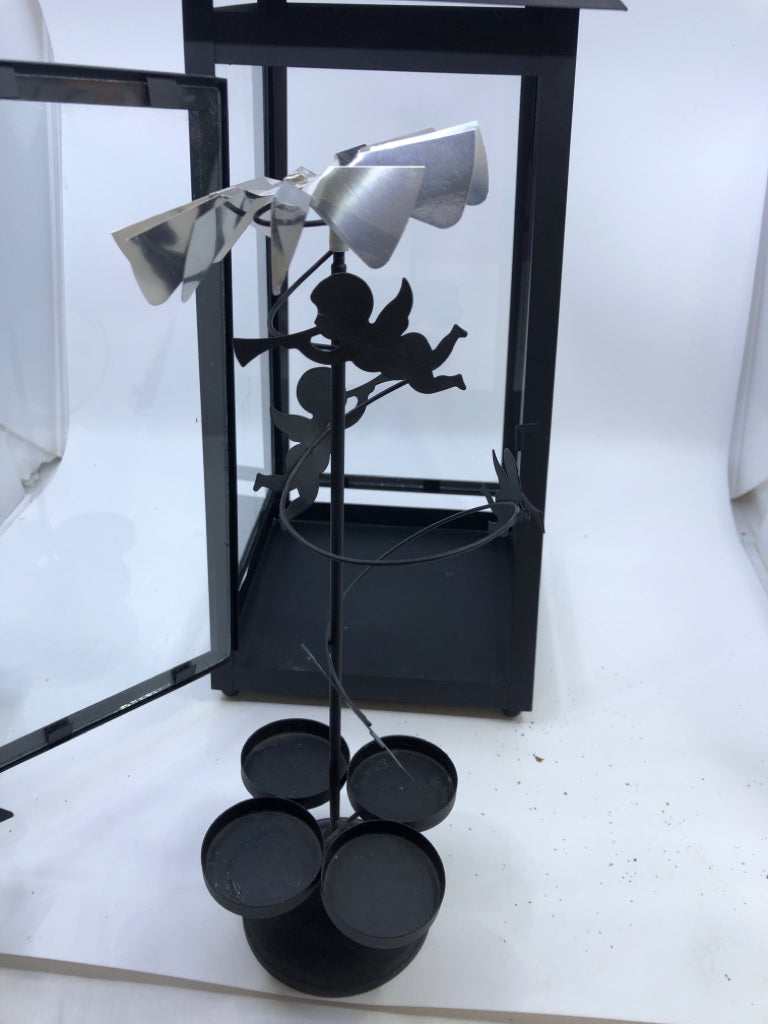 BLACK METAL TEALIGHT LANTERN WITH HOLIDAY OPTIONS .