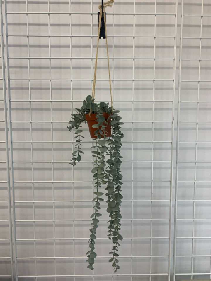 FAUX EUCALYPTUS IN HANGING PLASTIC POT.