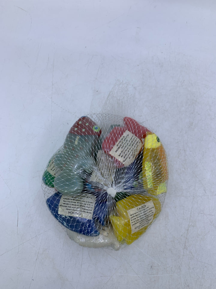 NIP ASSORTED FISH TEA LIGHT CANDLES IN NET BAG.