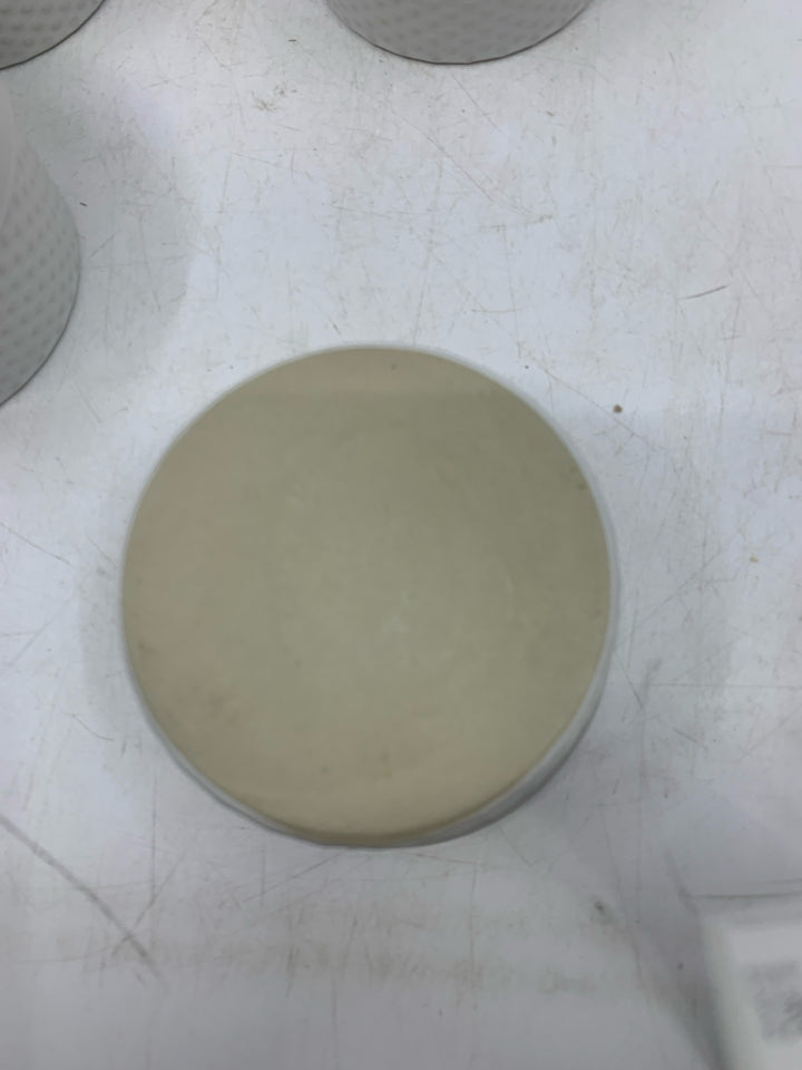 4 WHITE SINGLE BAKERS W/ EMBOSSED CIRCLES.