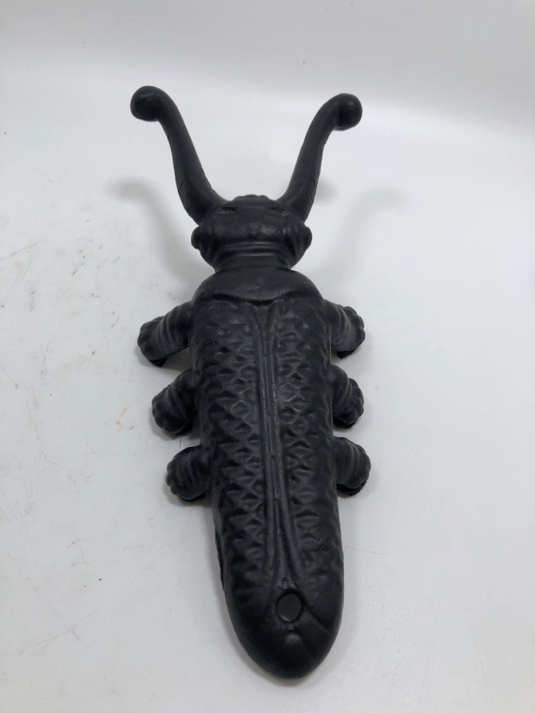 BLACK METAL BEETLE BOOT JACK.