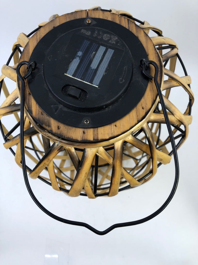 SOLAR POWERED WICKER LANTERN.