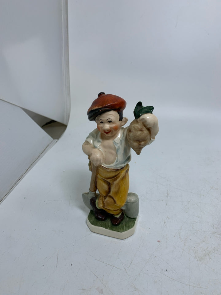 VTG FRIEDEL GERMAN MAN HOLDING RADISH.