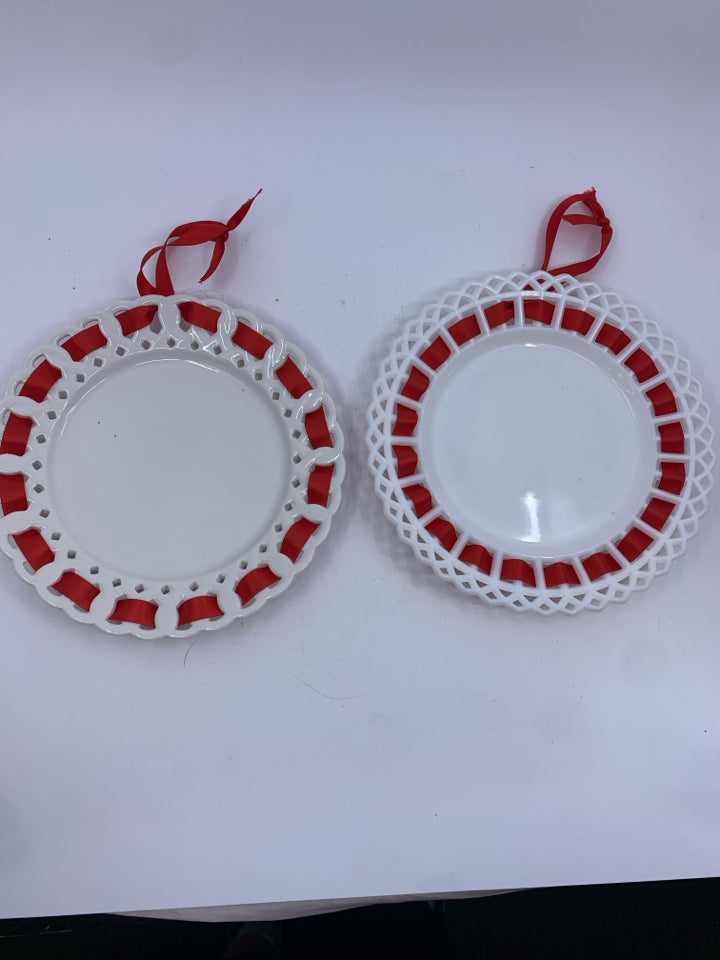 2 MILK GLASS RED RIBBON WALL ART.