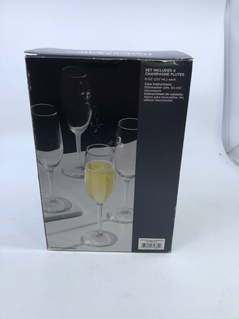 4 NIB CHAMPAGNE FLUTES.