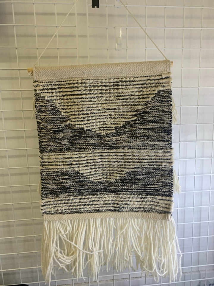 BLACK AND WHITE SHAG WALL HANGING.