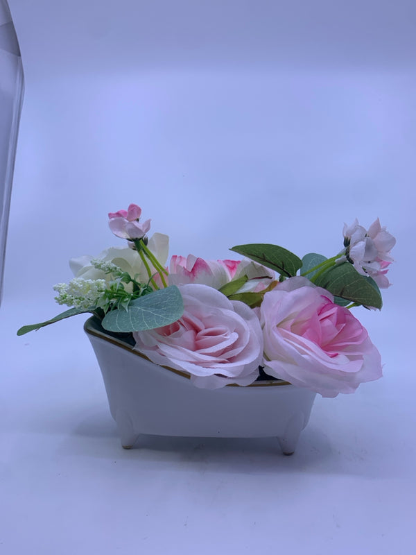 FAUX BOUQUET PINK FLOWERS IN WHITE CERAMIC PLANTER SHAPED BATH TUB.