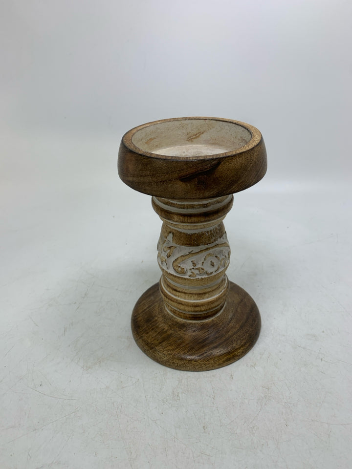 CARVED PILLAR CANDLE HOLDER W/ WHITE DETAILS.
