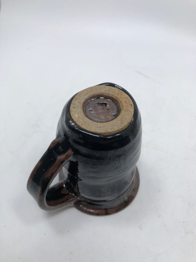 HAND SPUN BLACK GLAZED POTTERY MUG.