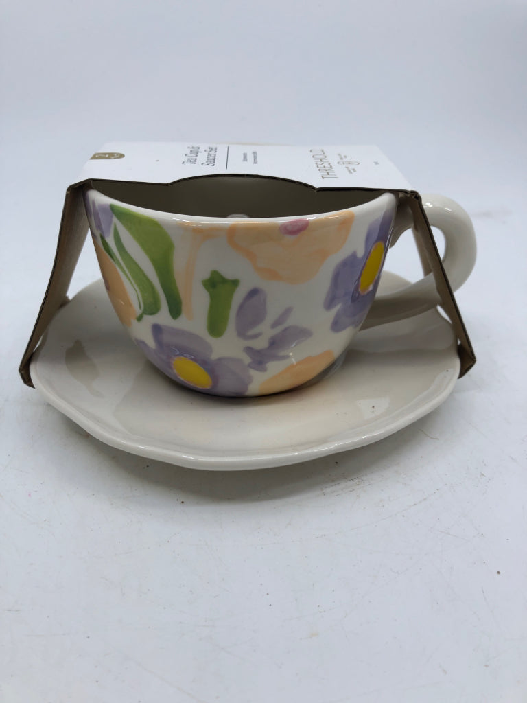 NIP TEACUP/SAUCER SET WHITE W/ PAINTED PURPLE FLOWERS RABBIT IN CENTER.