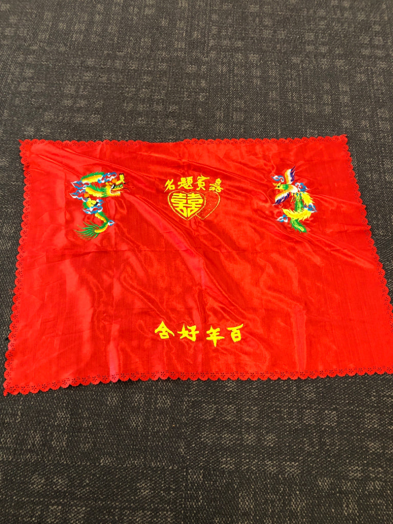 RED TABLE CLOTH W CHINESE DRAGON AND LETTERS.