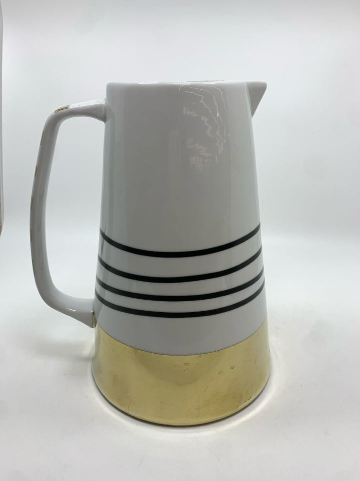 WHITE CERAMIC PITCHER W/BLACK AND GOLD STRIPES.