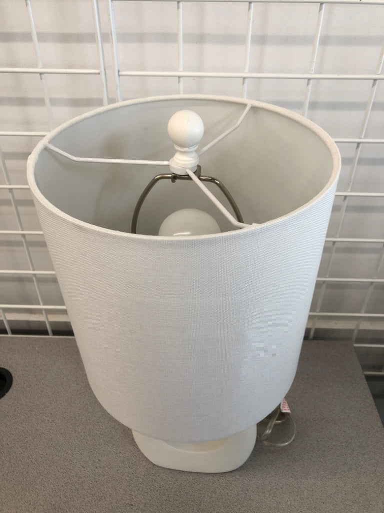 LAMP W/ WHITE SHADE AND ABSTRACT TWINE BASE.