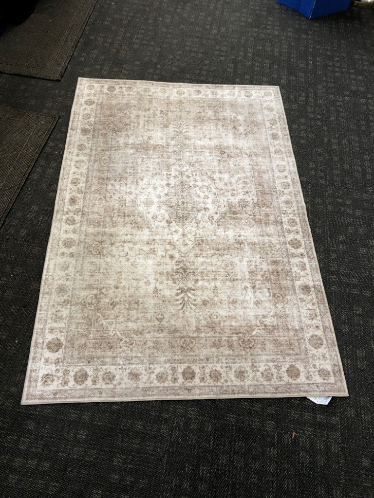 LIGHT GRAY RUG.