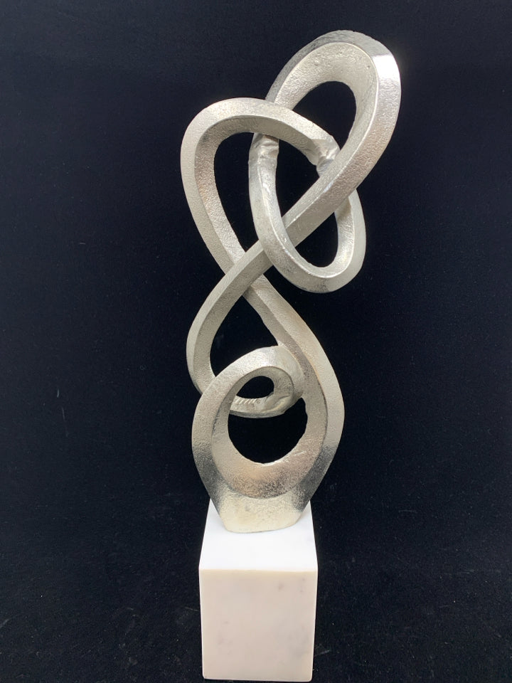 ABSTRACT METAL SCULPTURE ON MARBLE BASE.