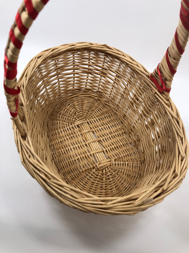 WICKER BASKET W/RED WRAP HANDLE.