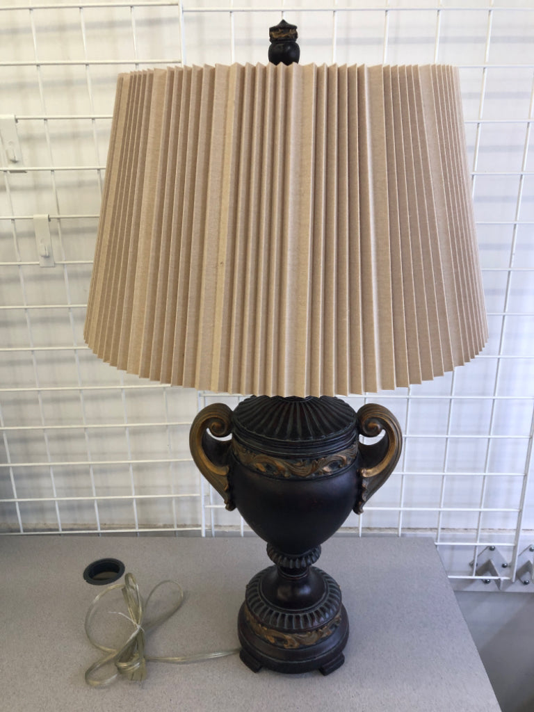 BROWN/GOLD LEAF LAMP BASE W/TAN ACCORDION SHADE.