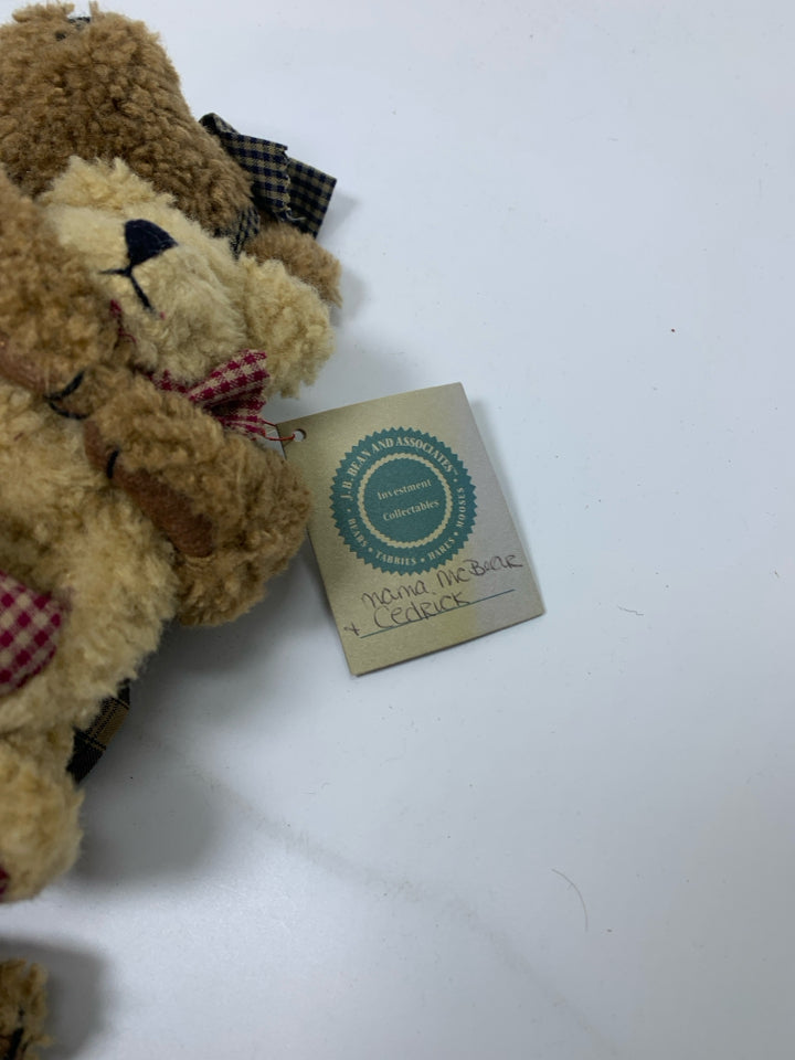 BOYDS BEAR HOLDING SMALLER BEAR IN PLAID DRESS.