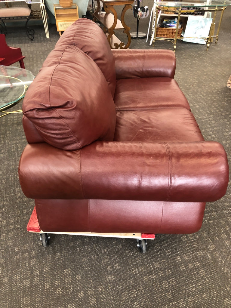 DARK BROWN STUDDED LOVE SEAT.