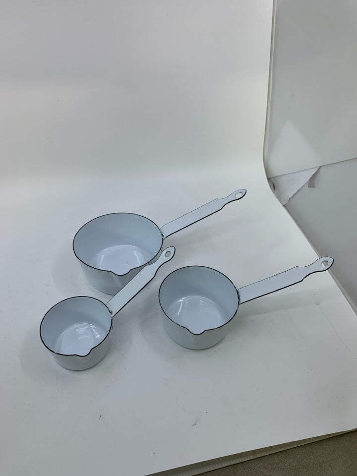 3 HEAVY NESTING ENAMEL WHITE SAUCE PANS.