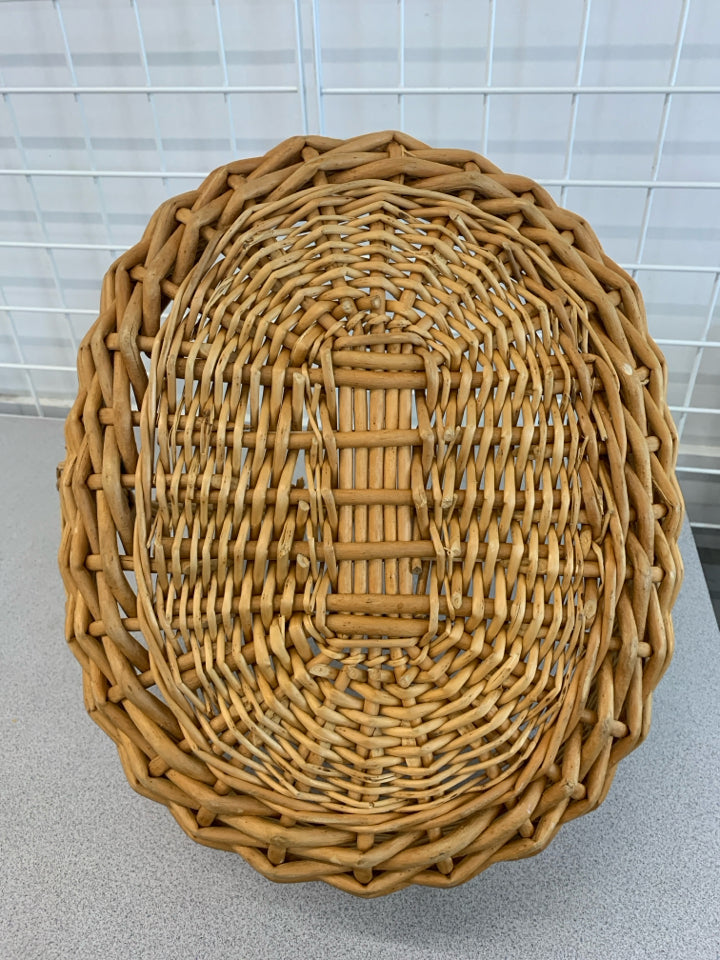 OVAL WICKER BASKET W/LARGE HANDLE.