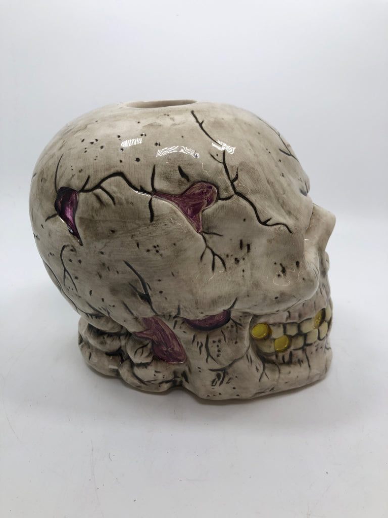 CERAMIC CRACKLE SKULL CANDLE HOLDER.