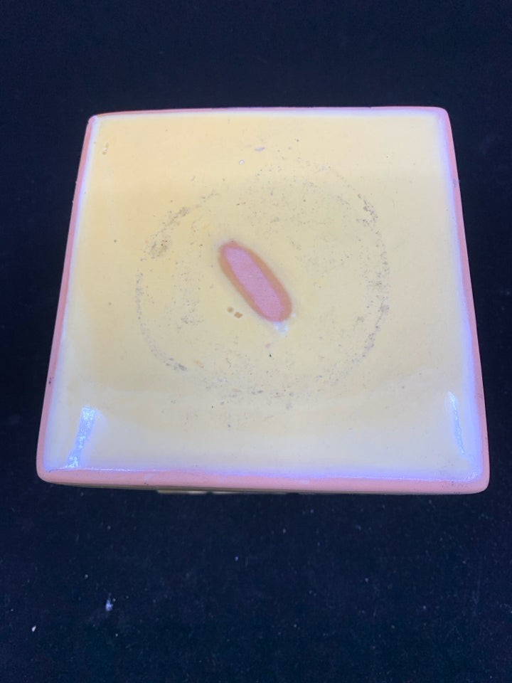 YELLOW, PINK, WHITE FLORAL DESIGN CANDLE PEDESTAL.