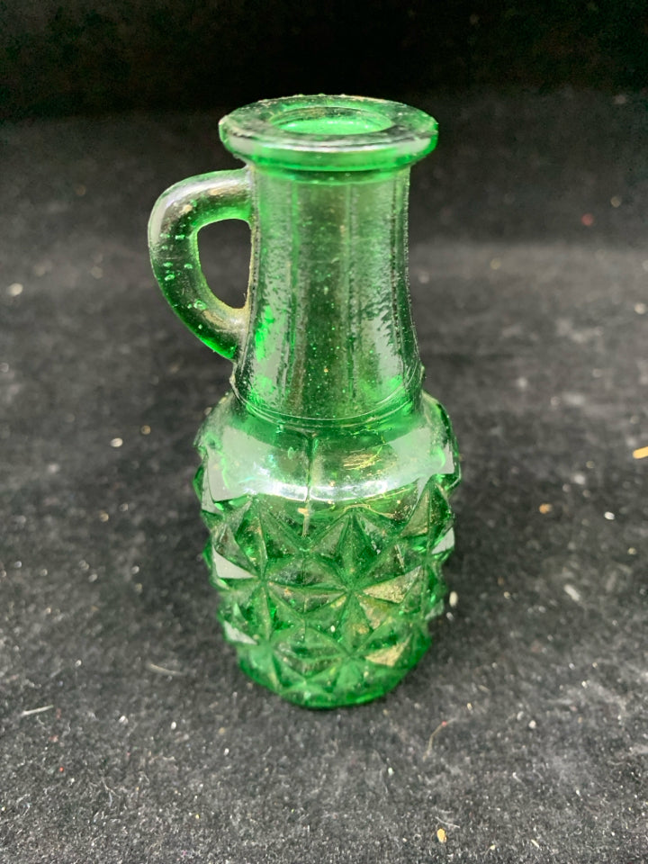 GREEN TEXTURED GLASS EMPTY BOTTLE W HANDLE.
