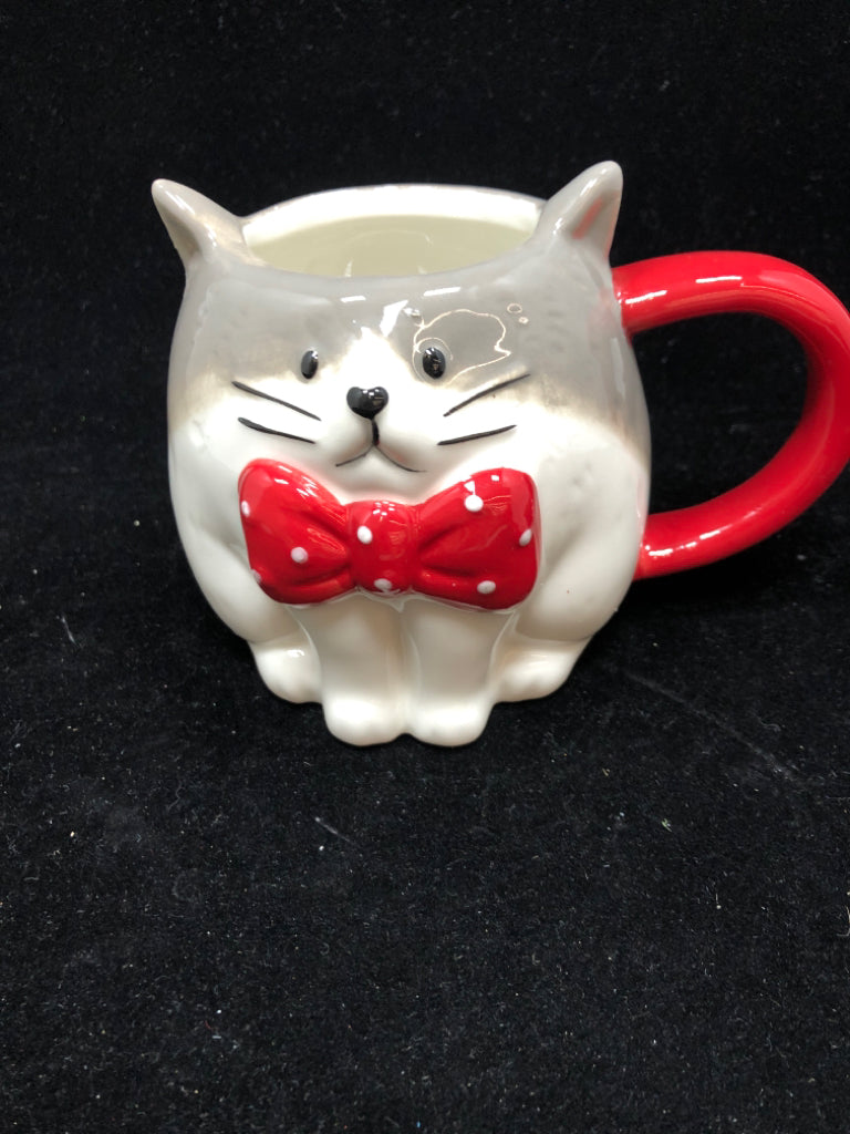 GREY/WHITE CAT MUG W/ RED BOW.