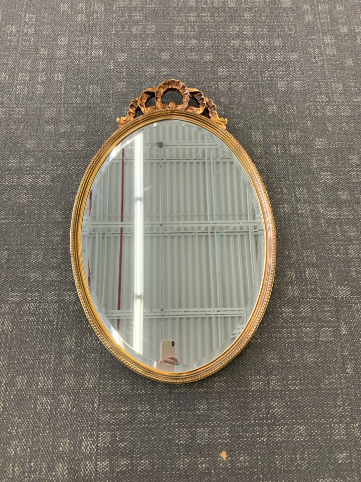 LARGE GOLD PAINTED MIRROR W/ BEADED EDGE W/ CUTOUT ON TOP.