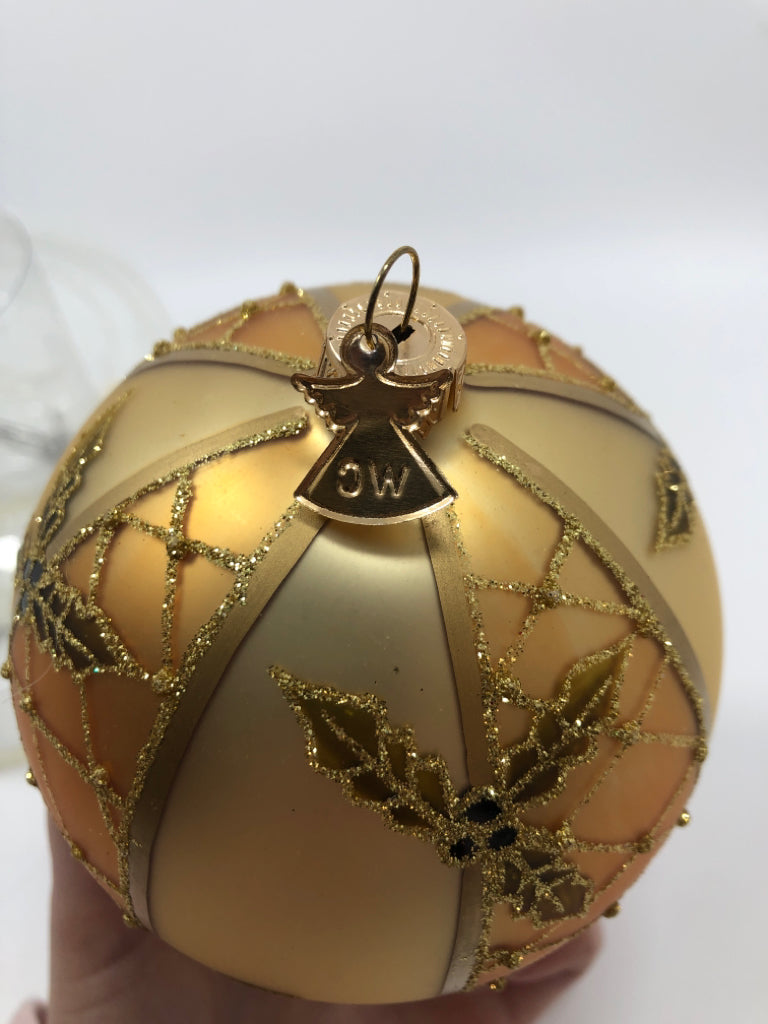 NWT GOLD GLITTER HOLLY PATTERN ORNAMENT.
