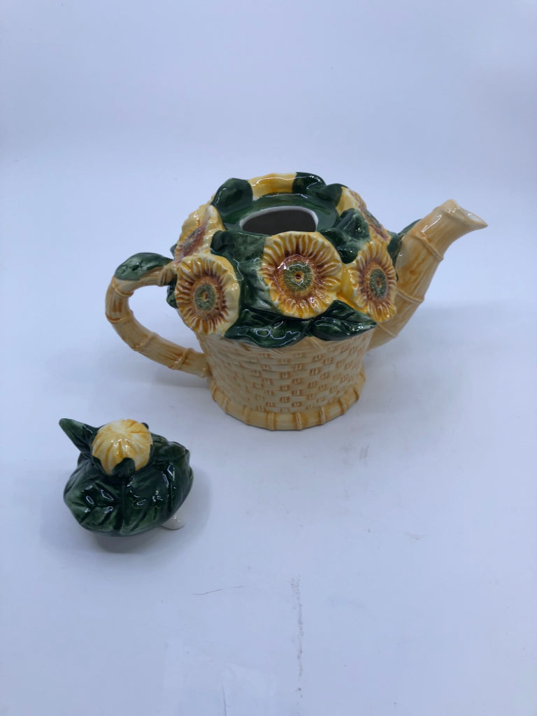 CERAMIC TEAPOT BASKET SHAPED W/ EMBOSSED SUNFLOWERS.