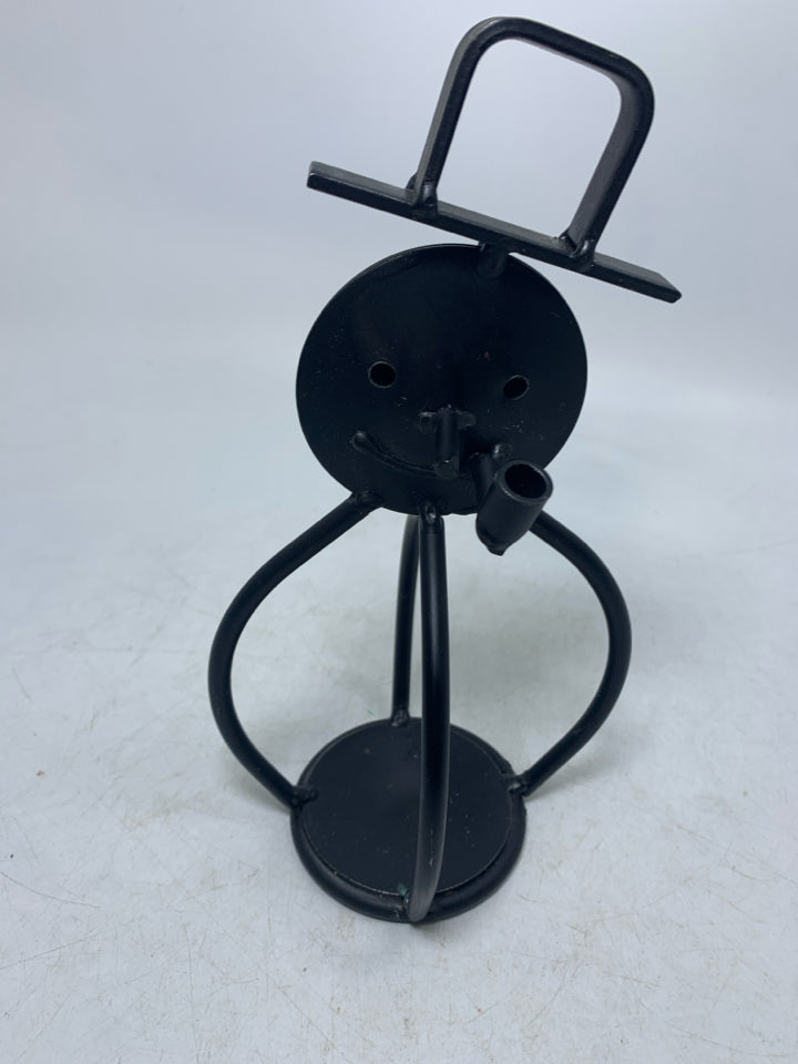BLACK METAL SNOWMAN SMOKING A PIPE TEALIGHT HOLDER.
