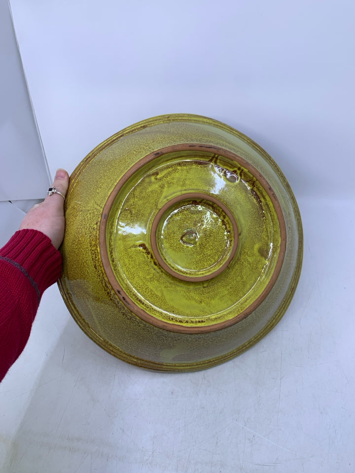 HEAVY TERRA COTTA SERVING BOWL W/ YELLOW OUTSIDE.