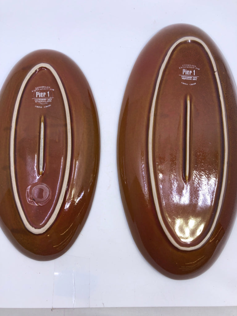 2 BROWN OVAL CERAMIC SERVING PLATES.