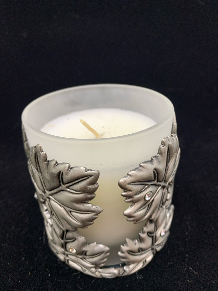METAL LEAF COVERED CANDLE.