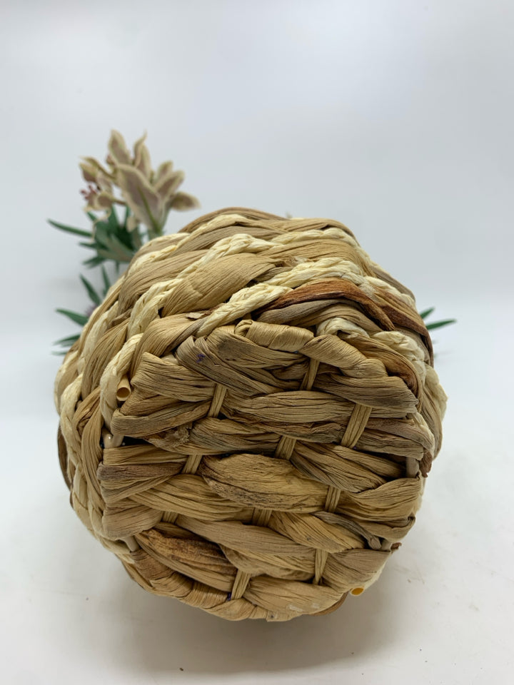 FLORAL MIX IN WICKER VASE.