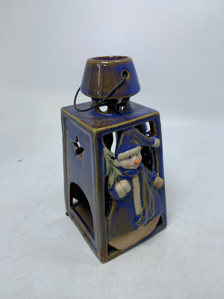 BLUE GLAZED PIERCED LANTERN W/ EMBOSSED SNOWMEN TEALIGHT HOLDER.