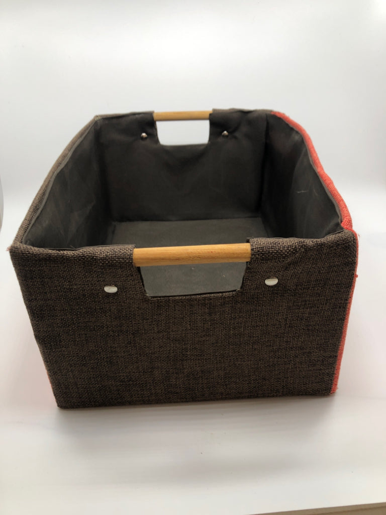 ORANGE/BROWN STORAGE BASKET W/WOOD HANDLES.
