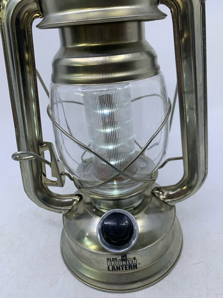LIGHT WEIGHT SILVER METAL BATTERY POWERS LANTERN.