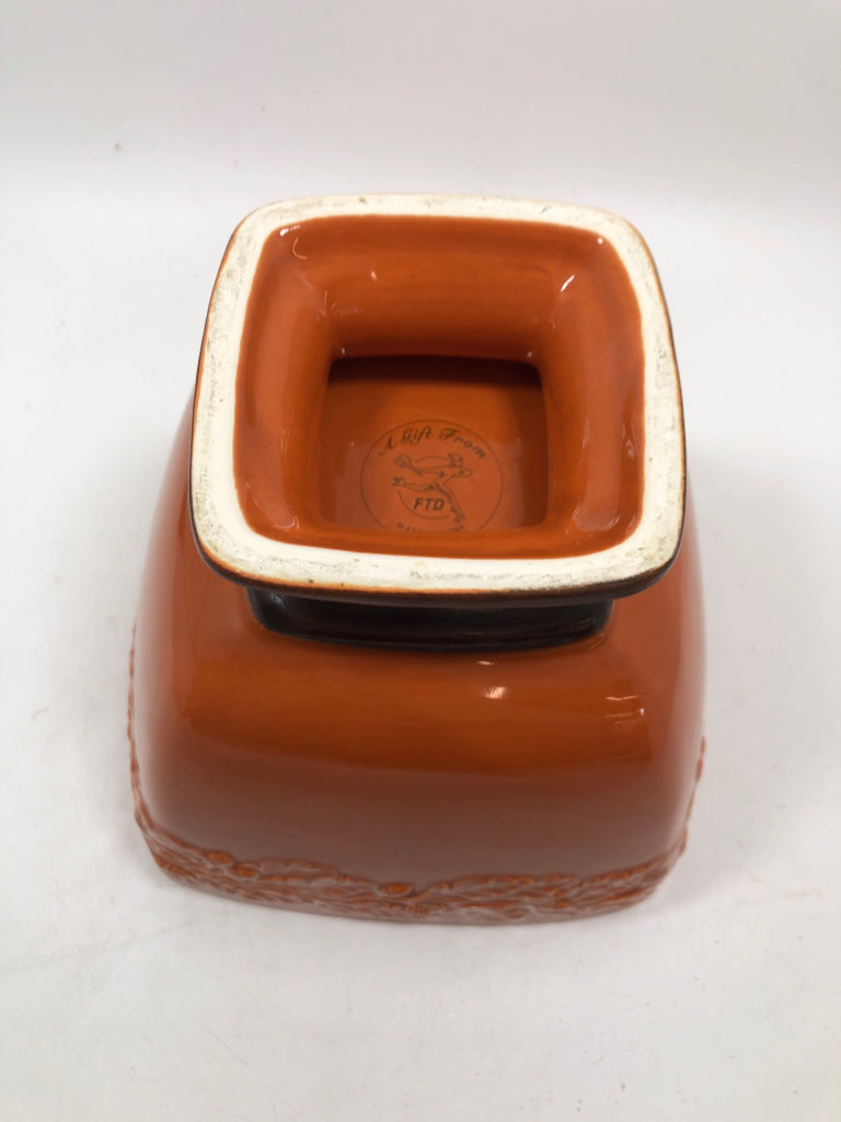 ORANGE PEDESTAL BOWL W/EMBOSSED ACORNS.