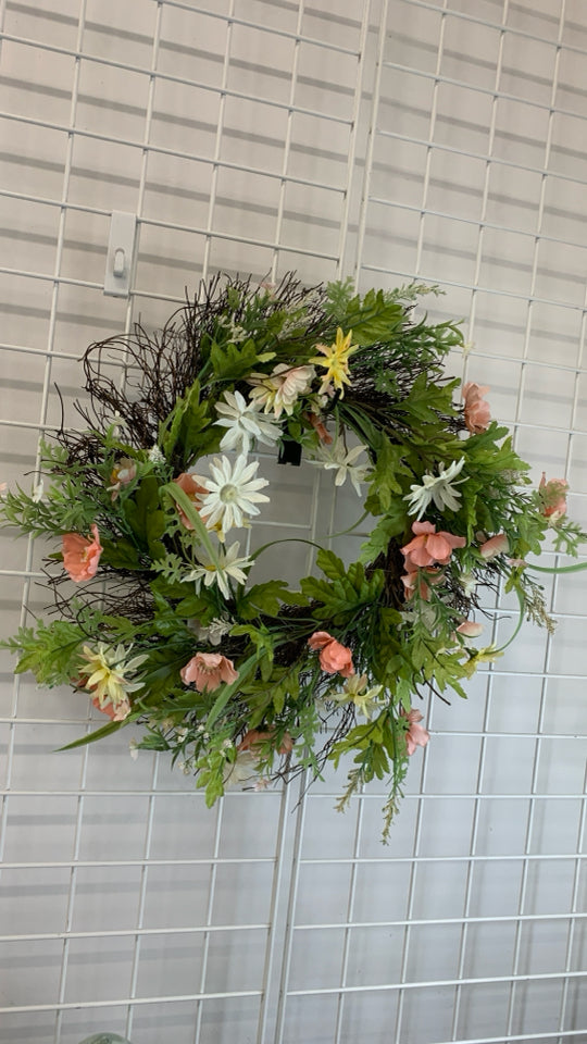 FAUX WILDFLOWER AND GREENS WREATH.